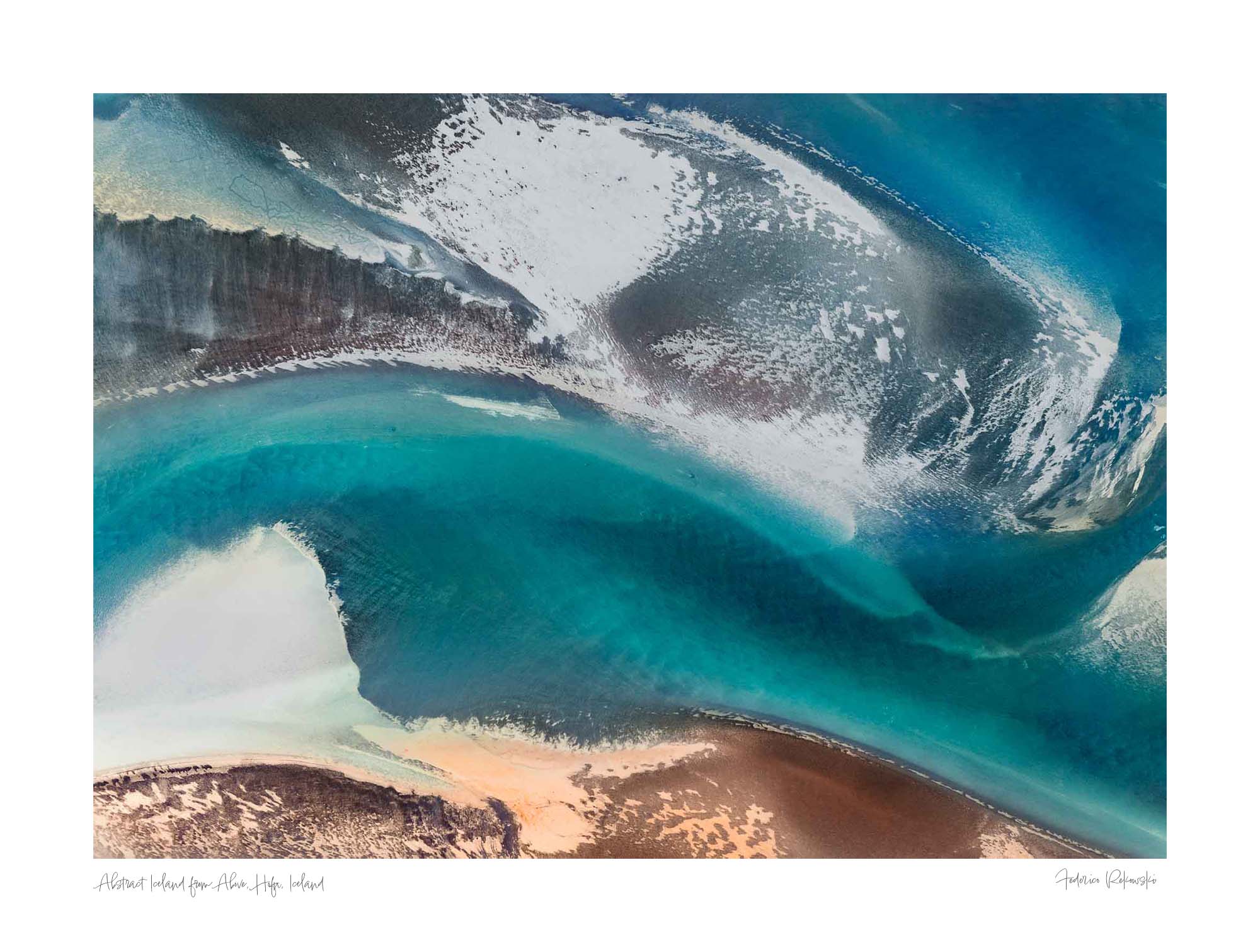 Aerial view of a stunning natural color palette in Iceland with shades of blue, white, and brown in an abstract composition.