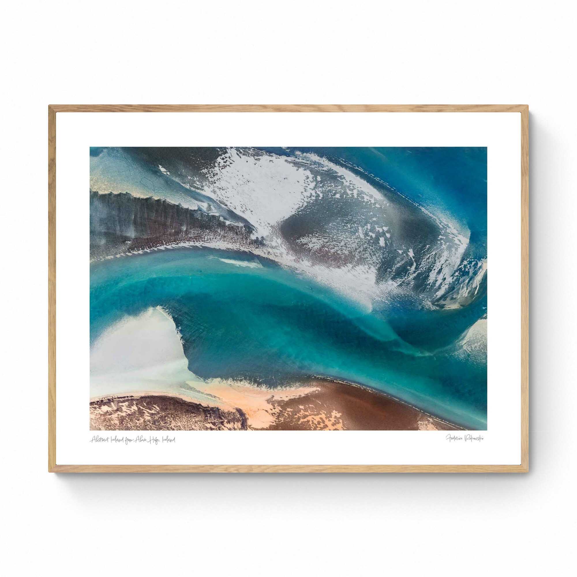 Aerial view of a stunning natural color palette in Iceland with shades of blue, white, and brown in an abstract composition.