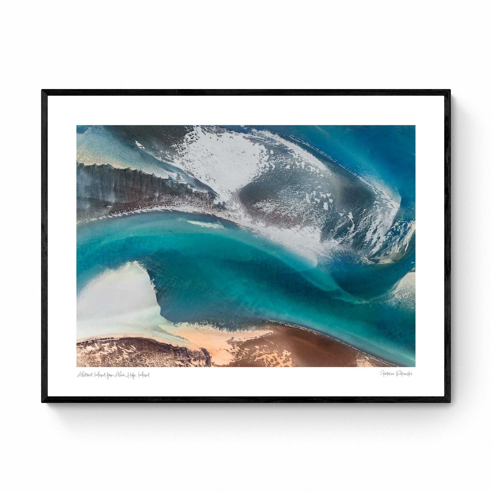 Aerial view of a stunning natural color palette in Iceland with shades of blue, white, and brown in an abstract composition.