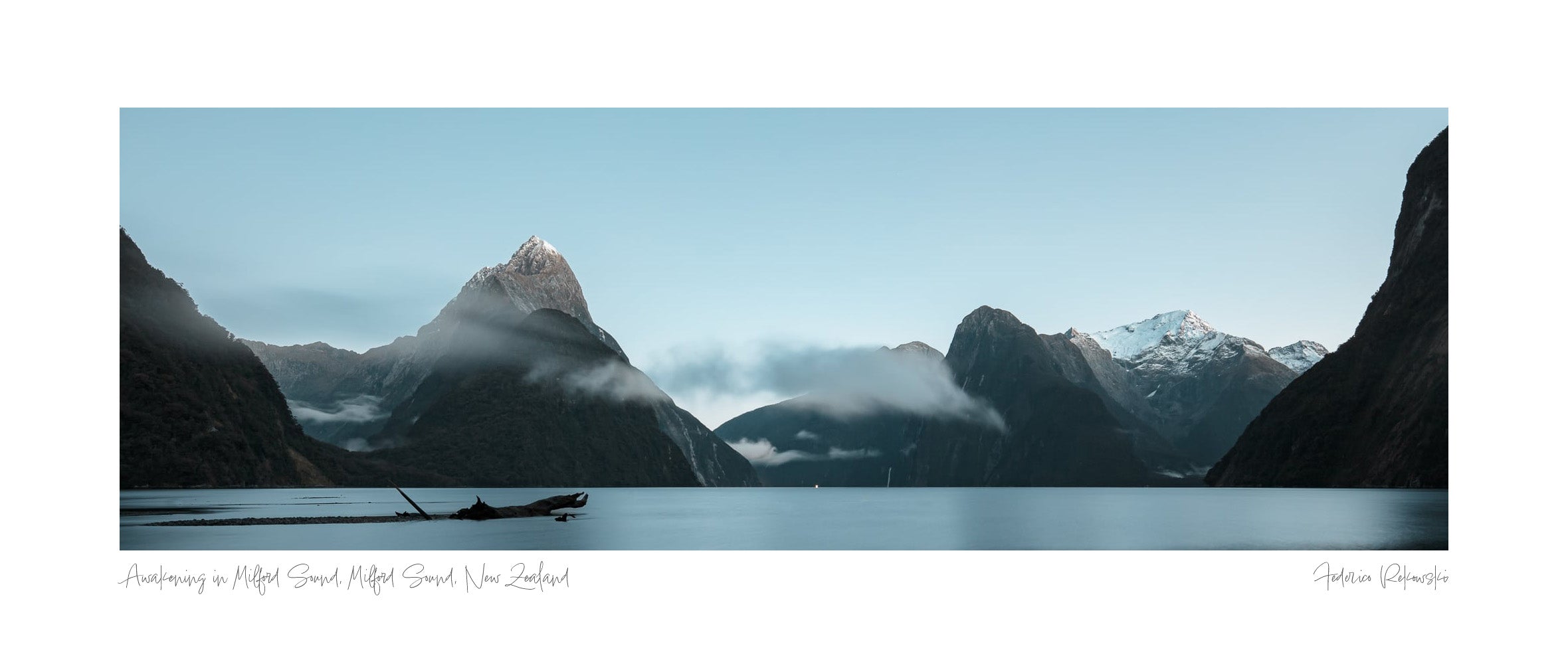 Panoramic view of Milford Sound in New Zealand, with the sunrise illuminating the mountain peaks and casting a tranquil light over the still waters. Wall Art