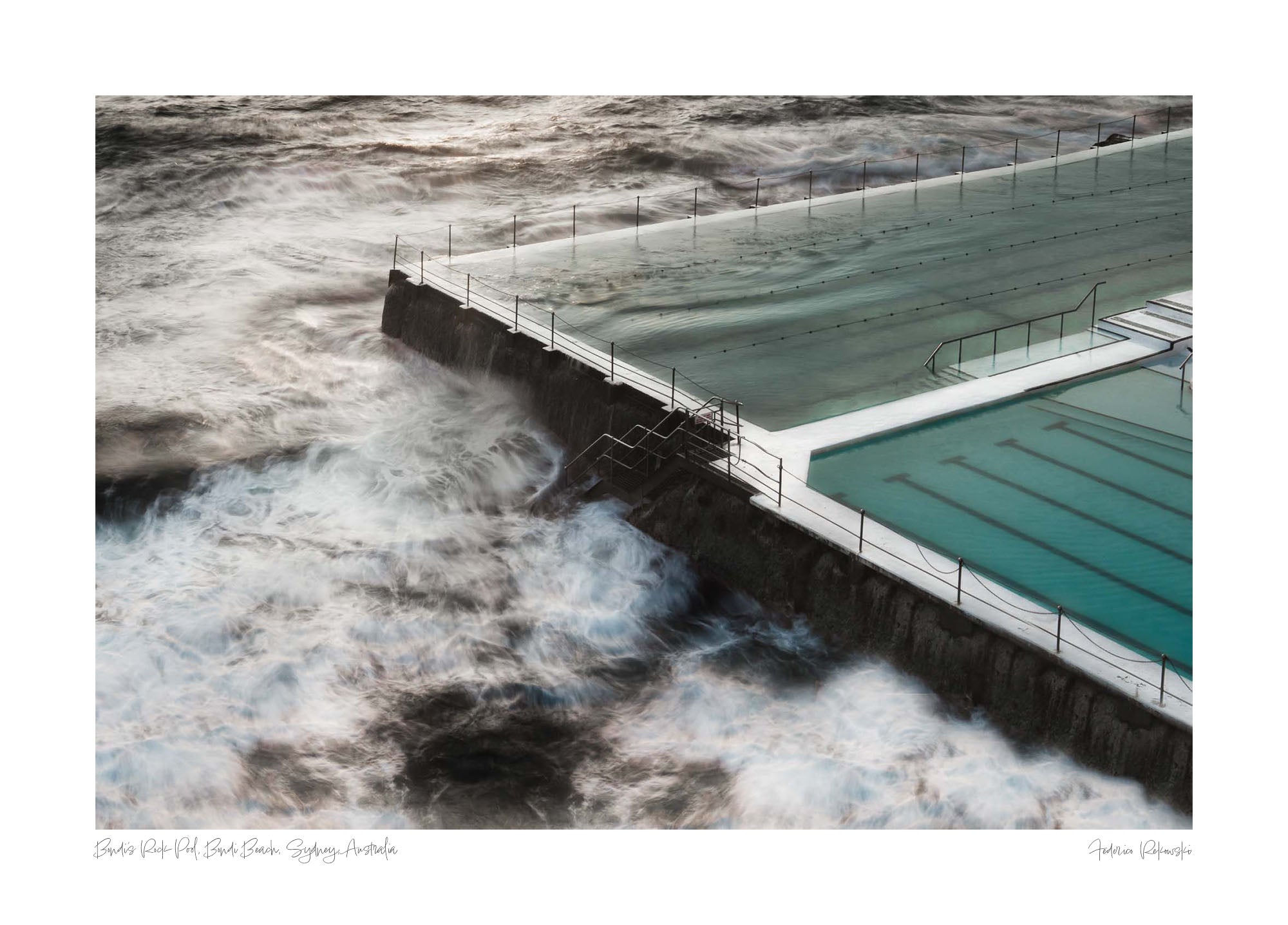 Long exposure of the Bondi Rock Pool in Sydney, with swirling ocean waves surrounding the calm waters of the pool.