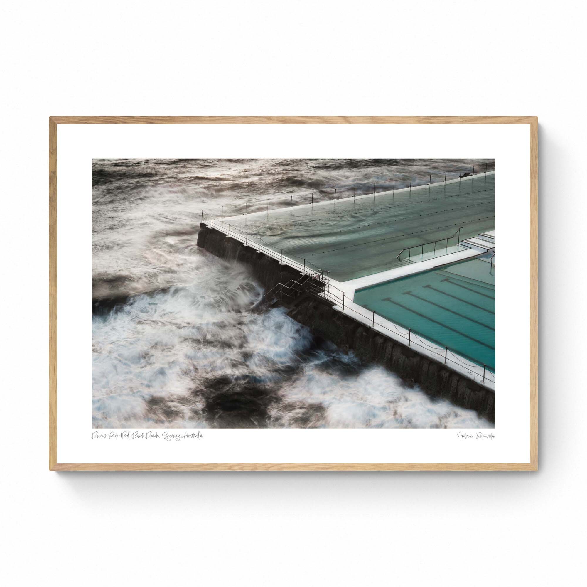 Long exposure of the Bondi Rock Pool in Sydney, with swirling ocean waves surrounding the calm waters of the pool.