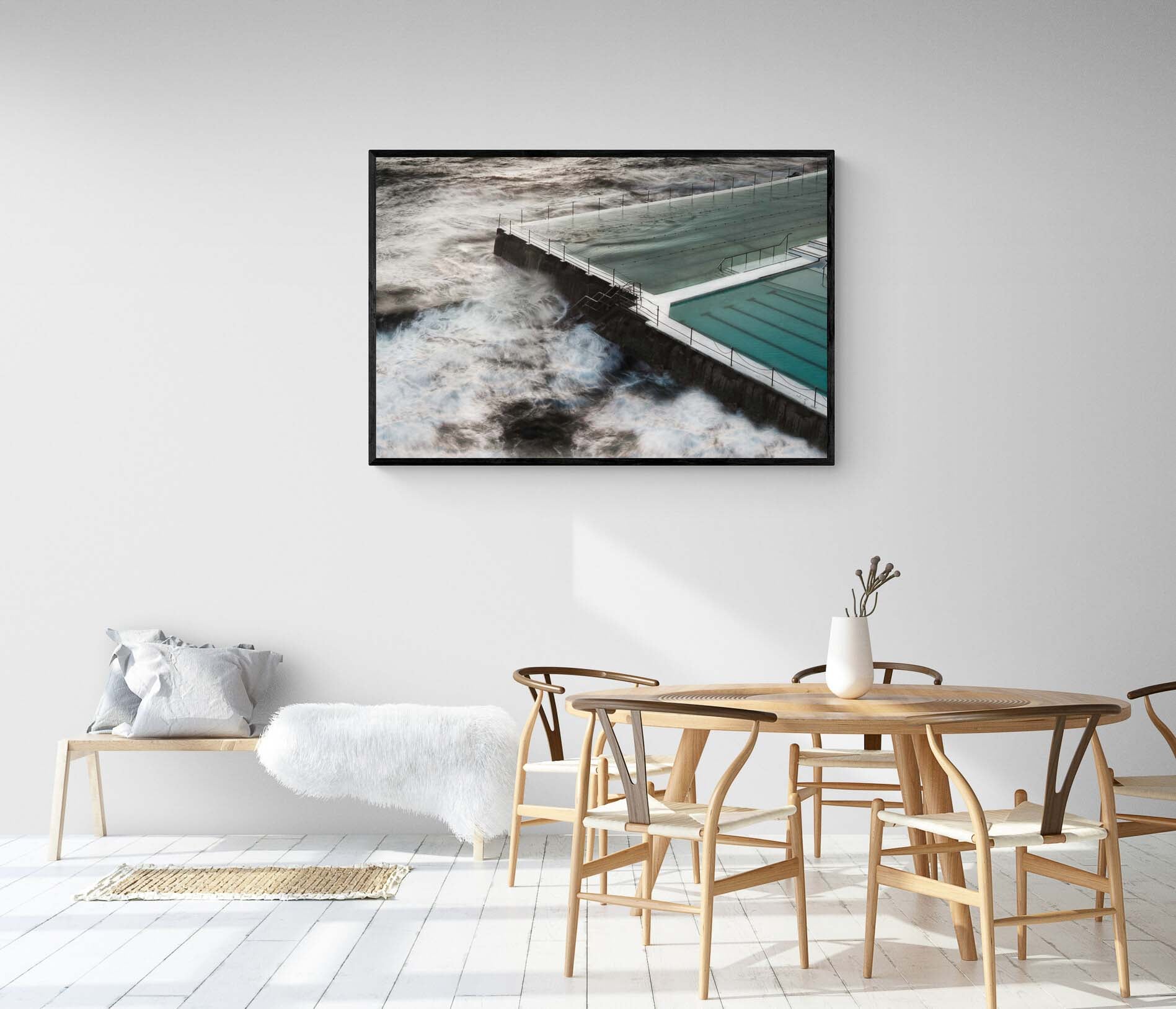 Long exposure of the Bondi Rock Pool in Sydney, with swirling ocean waves surrounding the calm waters of the pool.