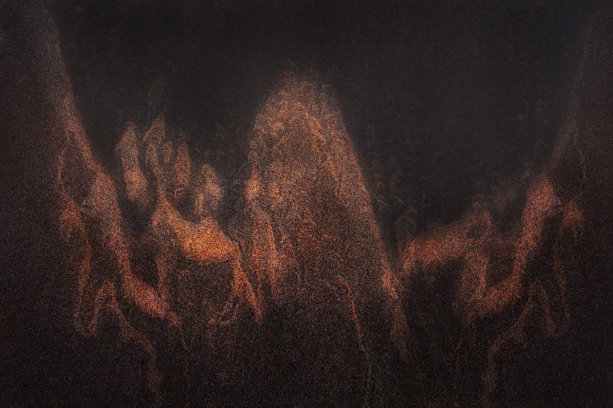 Abstract image resembling an eagle with copper-toned highlights on the sandy surface at Aireys Inlet, Victoria.