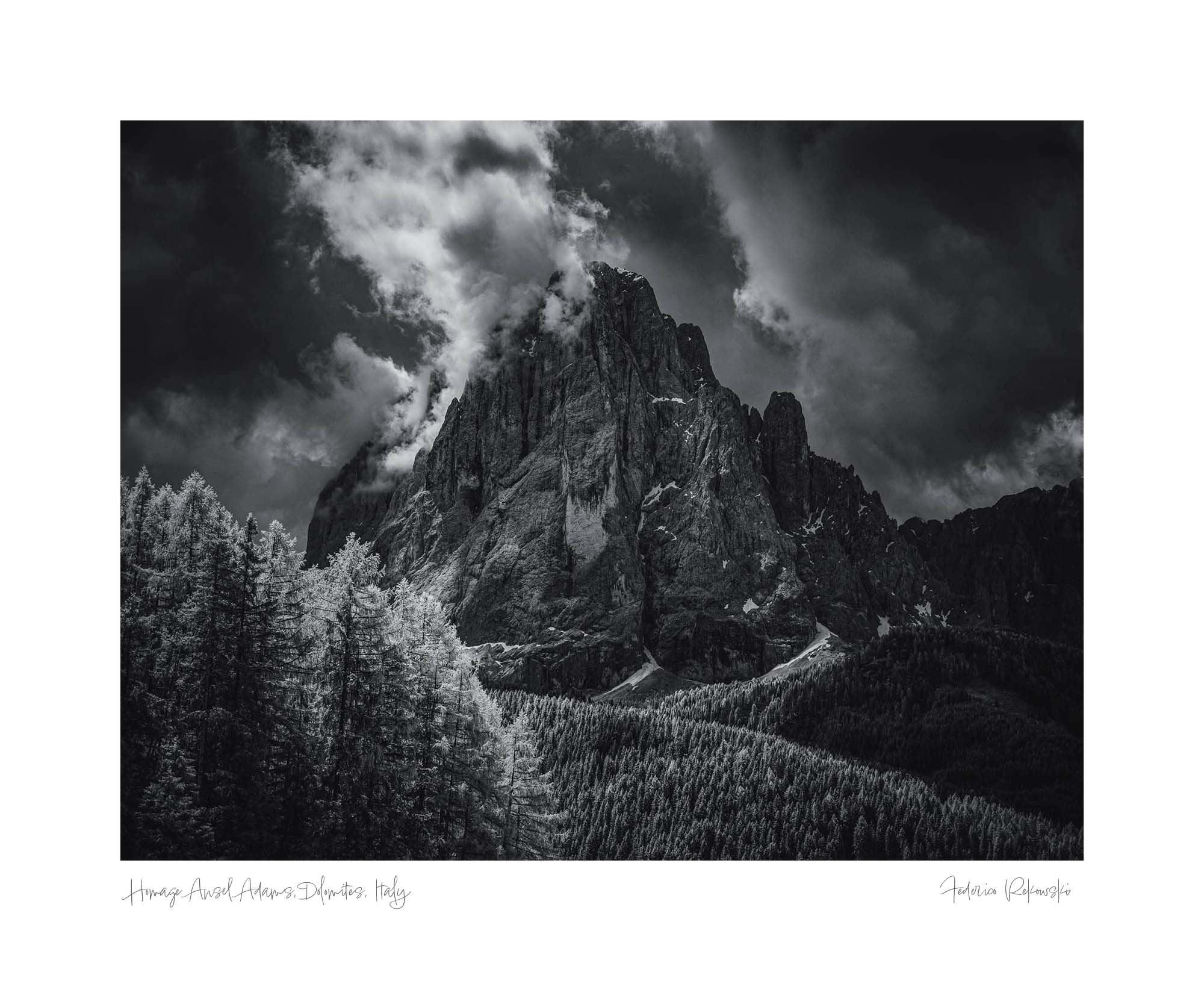 Infrared black and white image of the Dolomites' rugged peaks and glowing forest, reminiscent of Ansel Adams' style.