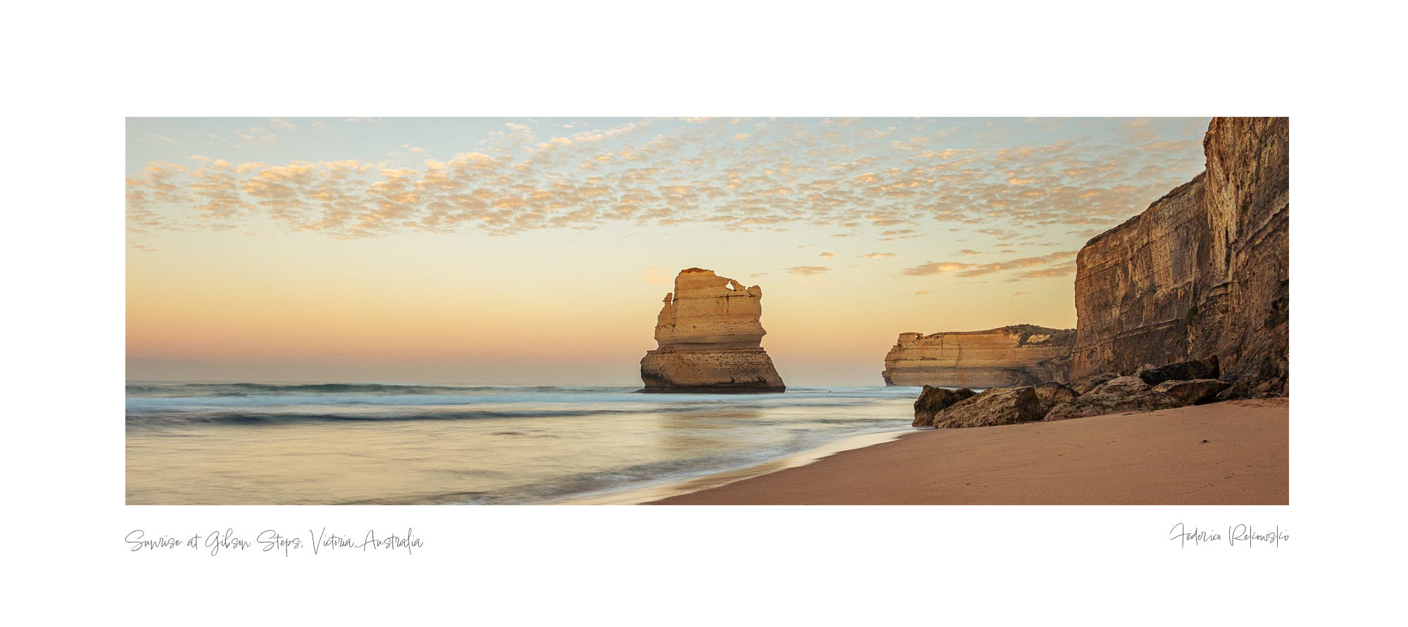 Twilight view of Gibson Steps beach with the Twelve Apostles limestone stacks against a pastel sky in Australia.