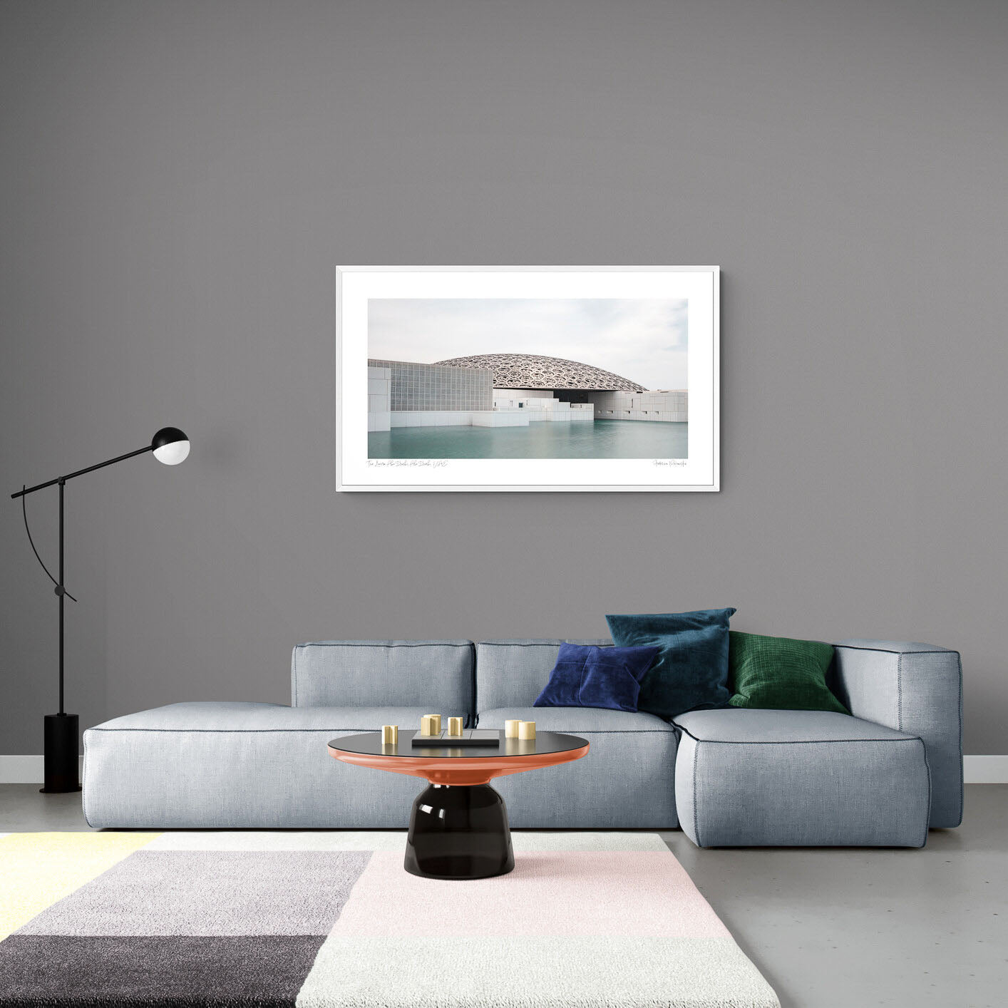 Wide-angle view of the Louvre Abu Dhabi’s intricate dome over calm water, under a soft sky.